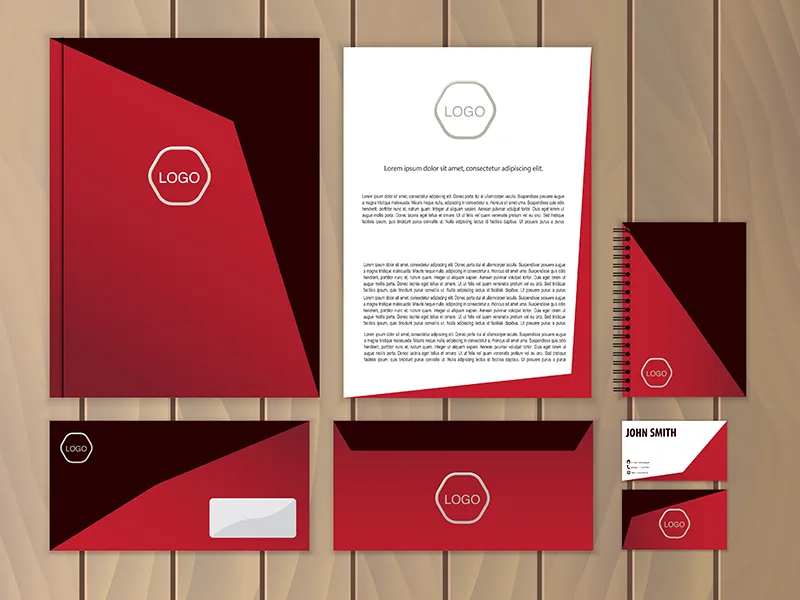 Matching red letterhead, envelopes, folder and business cards